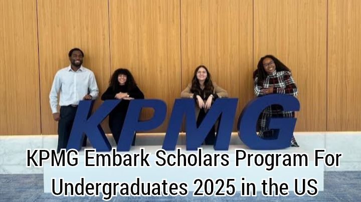 "Four individuals pose with large blue letters spelling 'KPMG' in front of a wooden wall. The image promotes the 'KPMG Embark Scholars Program for Undergraduates 2025 in the US.'"