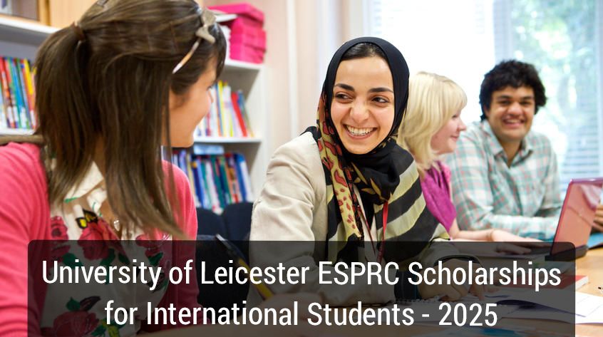 A diverse group of students is engaged in a study session at a library or study room. The students are seated at a table with bookshelves in the background. The image promotes the University of Leicester ESPRC Scholarships for International Students for the year 2025.